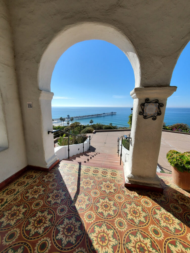 View of San Clemente pier through archway