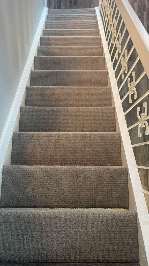 Shaw Carpet installed on stairs showing the main flight.