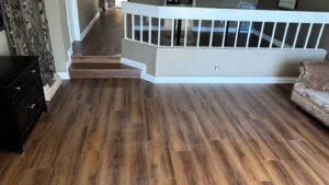 GemCore Laminate Flooring Sophisticated Performance Installation in the family room