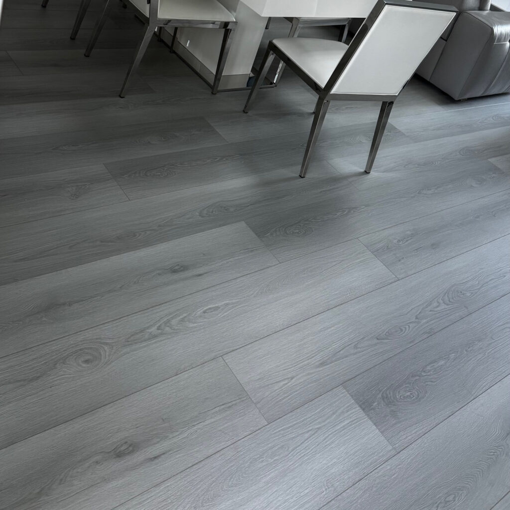 Laminate flooring install in dining room with up to 300 hours waterproof.